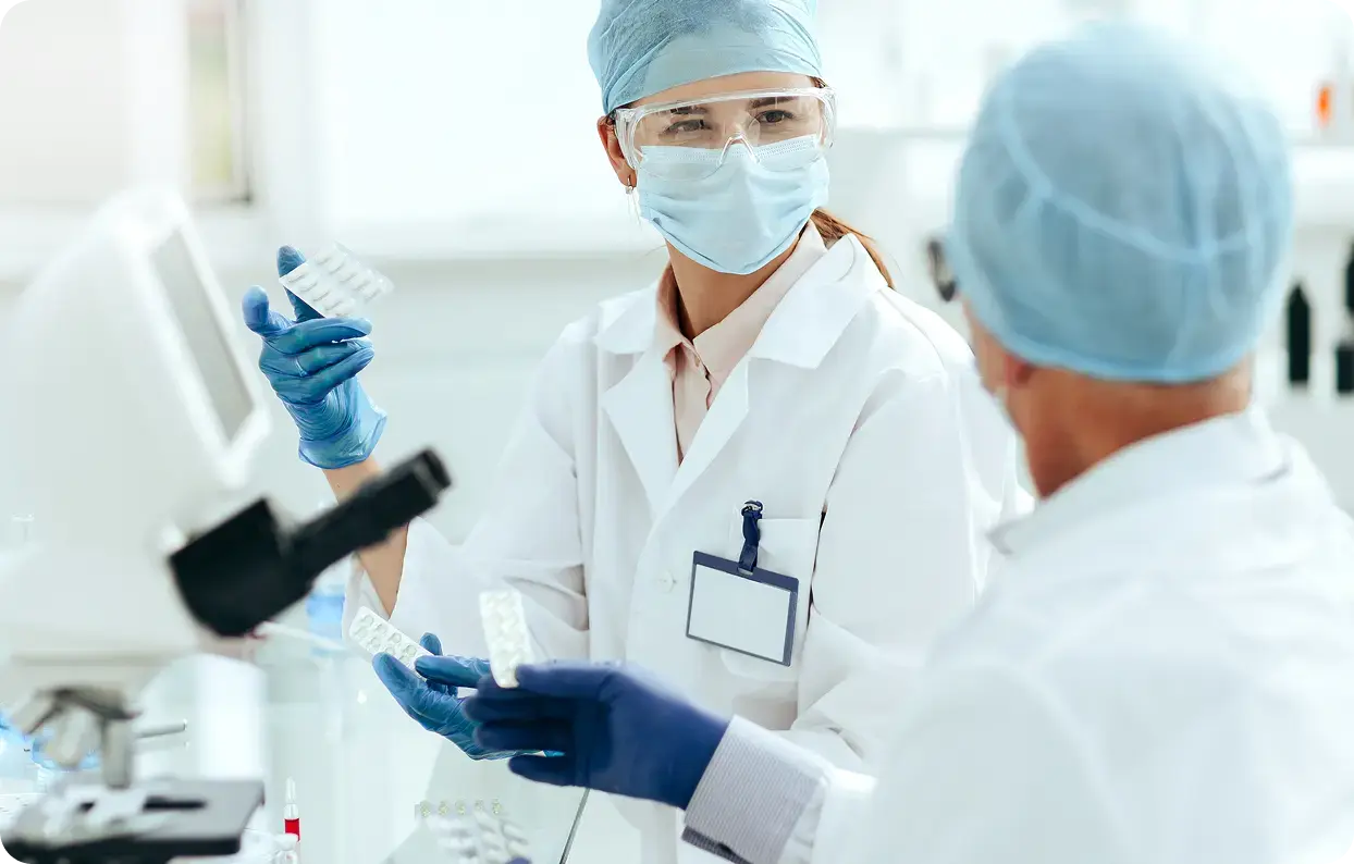 two scientists in a lab two scientists in a lab